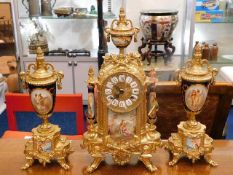 A Sevres style brass garniture clock set