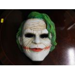 A joker style ceramic mask