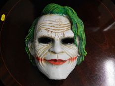 A joker style ceramic mask