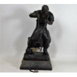 A c.1900 bronze figure of foundry worker by Otto S