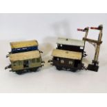 Four early 20thC. tinplate carriages & a railway s