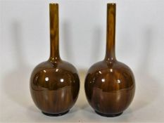 A pair of Burmantofts art pottery vases 9.5in high