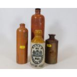 A Ross’s stoneware ginger beer bottle & three othe