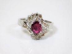 A 14ct white gold ruby & diamond cluster ring 5.3g