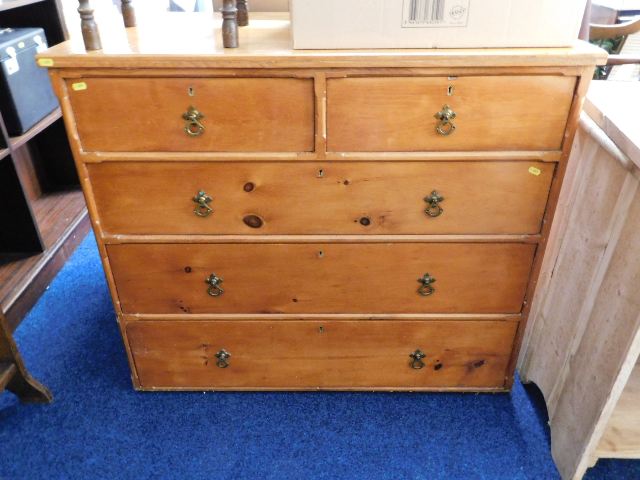 An antique pine chest of drawers