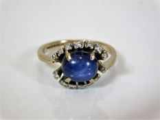 An 18ct white gold diamond & star sapphire ring 5.