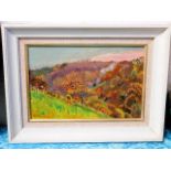 A framed oil painting of hillside meadow signed Ma