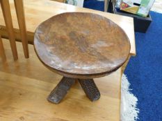 A small carved ethnic folk art style table