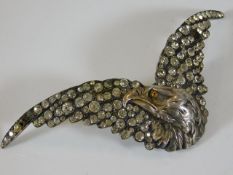 An early 20thC. white metal eagle brooch, approx.