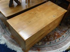 A bespoke hand made in Cornwall footed elm blanket box