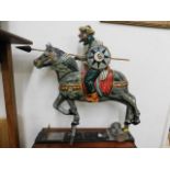 A horse & rider from part of an arcade game