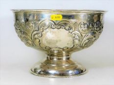 A silver rose bowl with embossed decoration 840g