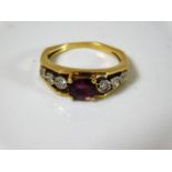 An 18ct gold ring set with ruby & diamonds 3.9g