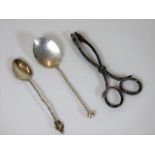 Two silver spoons twinned with a pair of 19thC. wh