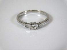 An 18ct white gold art deco style ring set with ta