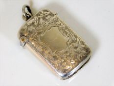 A silver vesta case with chased decor