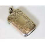 A silver vesta case with chased decor