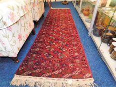 A vintage Persian style wool runner 114in x 30.5in