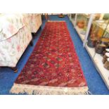 A vintage Persian style wool runner 114in x 30.5in