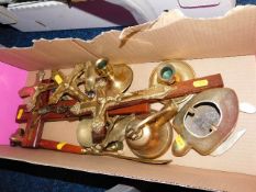 A boxed quantity of brass ware including crucifixe
