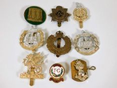 A quantity of mostly military related badges
