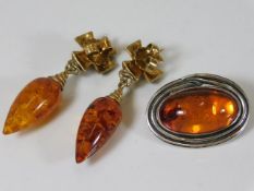 A silver mounted amber earring & brooch set