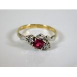 An 18ct gold & platinum diamond & ruby ring 2.6g