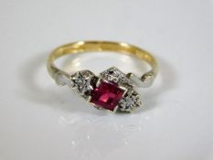 An 18ct gold & platinum diamond & ruby ring 2.6g