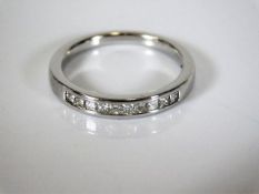 An 18ct white gold half eternity diamond ring 2.5g