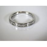 An 18ct white gold half eternity diamond ring 2.5g