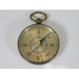 A vintage brass pocket compass
