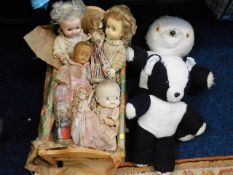 Seven dolls, a crib & two pandas