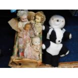 Seven dolls, a crib & two pandas