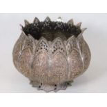 A c.1900 Burmese style silver on copper pot, profu