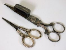 A pair of silver handled needlework scissors twinn