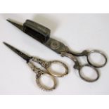 A pair of silver handled needlework scissors twinn