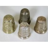 Three silver thimbles & one white metal