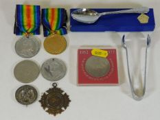 A small selection of badges, commemorative medals