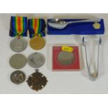 A small selection of badges, commemorative medals