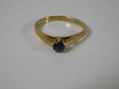 A 9ct gold ring set with blue stone 2.1g