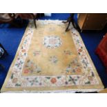 A large Chinese wool rug, 100in x 67in