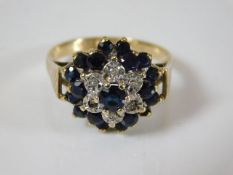 A 9ct gold ring set with sapphire & small diamonds