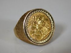A 9ct gold ring set with full sovereign