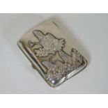 An Oriental silver cigarette case with applied nat