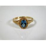 A 9ct gold ring set with topaz style stone 1.5g