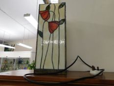 A Tiffany style glass lamp, indistinctly signed to rear