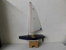 A remote control model yacht 28in long by 46in hig