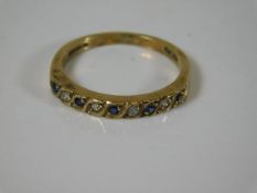 A 9ct gold half eternity ring set with sapphire &