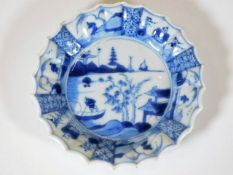 A small 18thC. Chinese porcelain dish with scallop