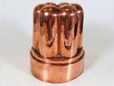 An antique copper jelly mould